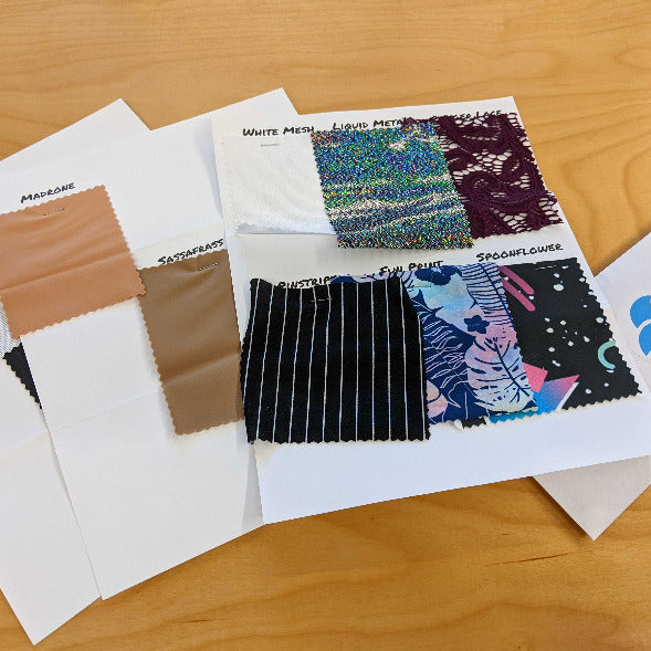 Sample cards of various Shapeshifters store fabrics.
